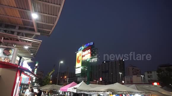 Tall steel frames are the trees for birds In Bangkok's concrete jungle