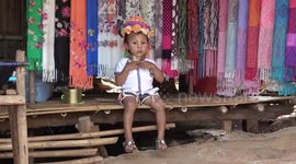 Children wear brass neck rings to fund 'human zoo' tourist attraction