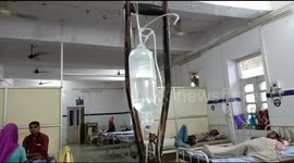 Bizarre scene at Indian hospital where crutch is used as stand for IV drip