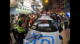 'Undercover Hong Kong police car' discovered by protesters and gets vandalised