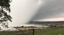 Thick fog and storm clouds roll into French town near Nantes