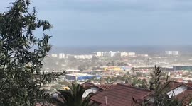 Unusual strong winds cover the city with dust