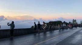 Tourists in awe of stunning blanket of mist and dew in northern Thailand