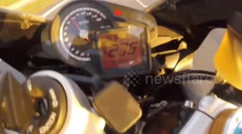 Motorbike rider has death-defying crash travelling at nearly 300km/h
