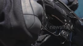 Special Forces soldier is holding an assault rifle