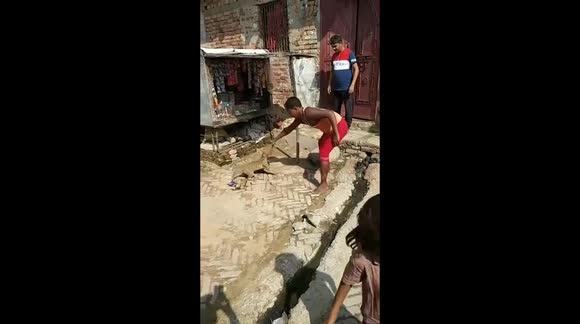 Cat rescued by locals after getting its head stuck inside plastic jar