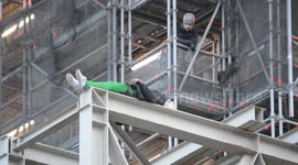 Extinction Rebellion protester clowns around after climbing Big Ben in jaw-dropping footage