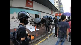 Protesters destroy a Xiaomi shop on Nathan road