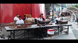 Kids Performing Traditional Thai Music Ranat Ek in the Streets to Attract Tourists