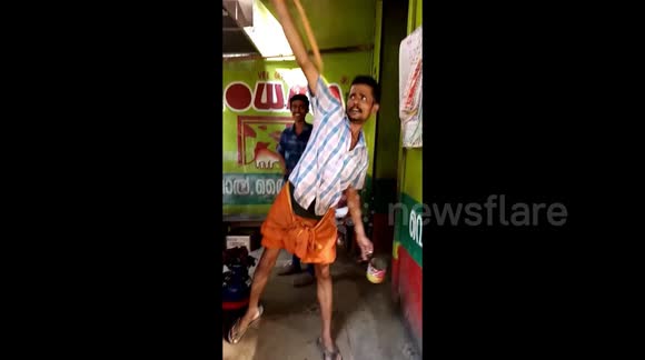 Indian tea seller showcases his extreme height pouring skills without spilling a drop