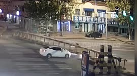 Height restriction barrier lands on car after being knocked down by truck in China