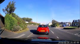 Driving instructor decides he does not want to wait for lights, what a way to teach.
