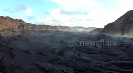 Standing in the steaming hardened, steaming lava river channel from Fissure 8