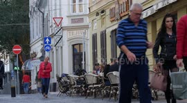 Pedestrian area detail with cafe terrace and people