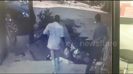 Two men fall into huge hole when pavement collapses in northern India