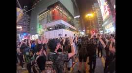 Protesters and residents of Chungking Mansions building complex sing 'Glory to Hong Kong'