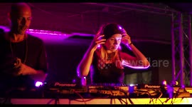 cool female dj perforning at outdoor party in barcelona