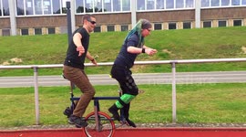 Duo attempt to ride two-seated unicycle in Germany