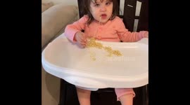 Adorable US toddler can't keep her eyes open while trying to eat noodles