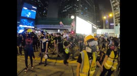 Standoff between Halloween masked protesters and riot police in Central Hong Kong