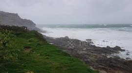 Sennen Cove , Cornwall  26ft swells hitting the coastline