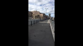 Tree drunk teenagers riding one scooter on a highway.