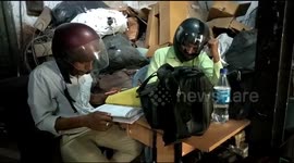 Indian government workers have to wear helmets indoors as office ceiling is crumbling
