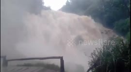 Spectacular moment heavy rain causes waterfall to overflow with raging torrents