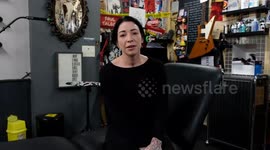 UK artist who gives nipple tattoos to breast cancer survivors has been banned from uploading the pictures to Facebook