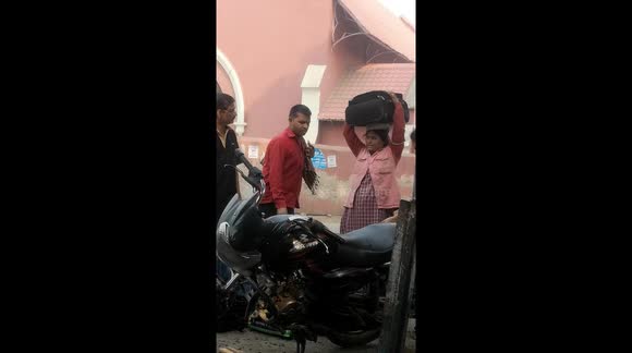 Indian Female Coolie works overtime to suffice family in Uttar Pradesh.