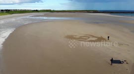 Incredible drone footage shows 100ft drawing of 'Edward Scissorhands' drawn on UK beach