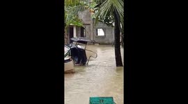 House collapses after Typhoon Nakri causes severe flooding in the Philippines