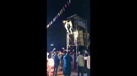 Thai Buddhist festival descends into chaos with followers fighting on speaker scaffolding