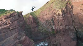 Breathtaking video captures daredevil backflipping off 51ft cliff in Scotland