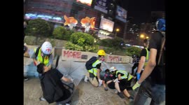 Very young Hong Kong protester is treated for rubber bullet injuries