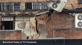 CLIMATE-DESTROYING REFRIGERANT APPARENTLY SPRAYING FROM AIR CONDITIONING UNIT DURING DEMOLITION: SLOW-MOTION CLOSE UP.