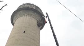 Adventurous bull makes its way up 200ft water tower prompting mammoth rescue operation