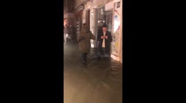 UK tourists wade through deep flood water as Venice is partially submerged