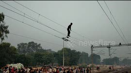 Youth swinging from overhead railway wire rescued in north India
