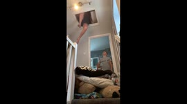 Wife asks husband to get the Christmas decs out the loft and gets stuck 