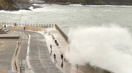 Huge waves crash over seawall in northern Spain