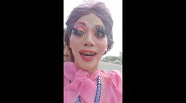 Hilarious moment drag queen struggles with eyelash extensions while riding motorcycle