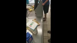 White guy being  racist  to a black cashier