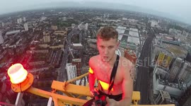 Heart-stopping moment daredevil documents himself standing on top of 200-metre crane in London without safety ropes