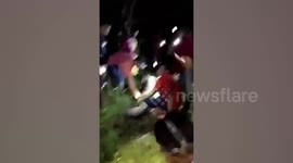 Gruesome moment dead man’s corpse is cut out of the stomach of a massive python in Indonesia