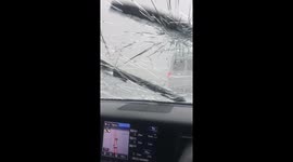 'Hailstones like ice bombs': Aussies cower in car as supercell storm unleashes on highway