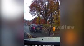 Dashcam footage shows moment toddler escapes serious injury when he tumbles out of moving taxi in UK