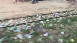 View Of Cambodian Slums From Train Carriage