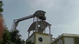 Allegedly unstable man rescued from rooftop in east India after threatening to jump