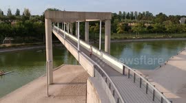 Girl running in the bridge in the park